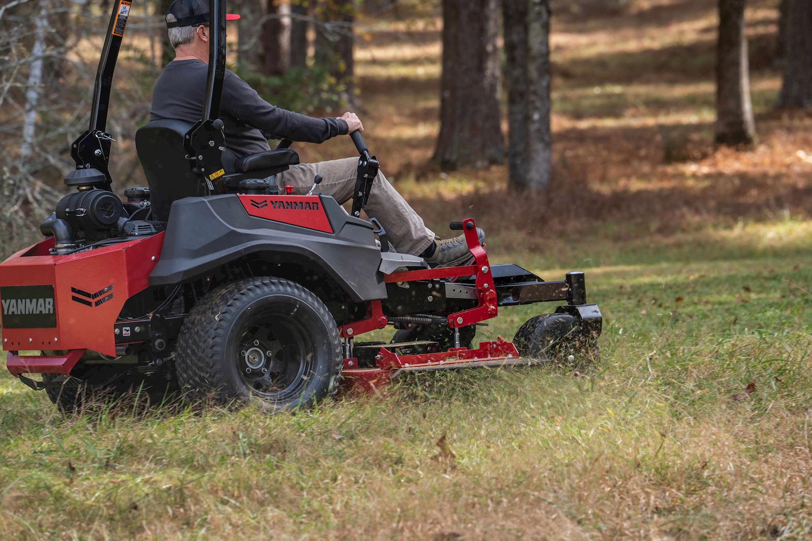 man mowing in a timber