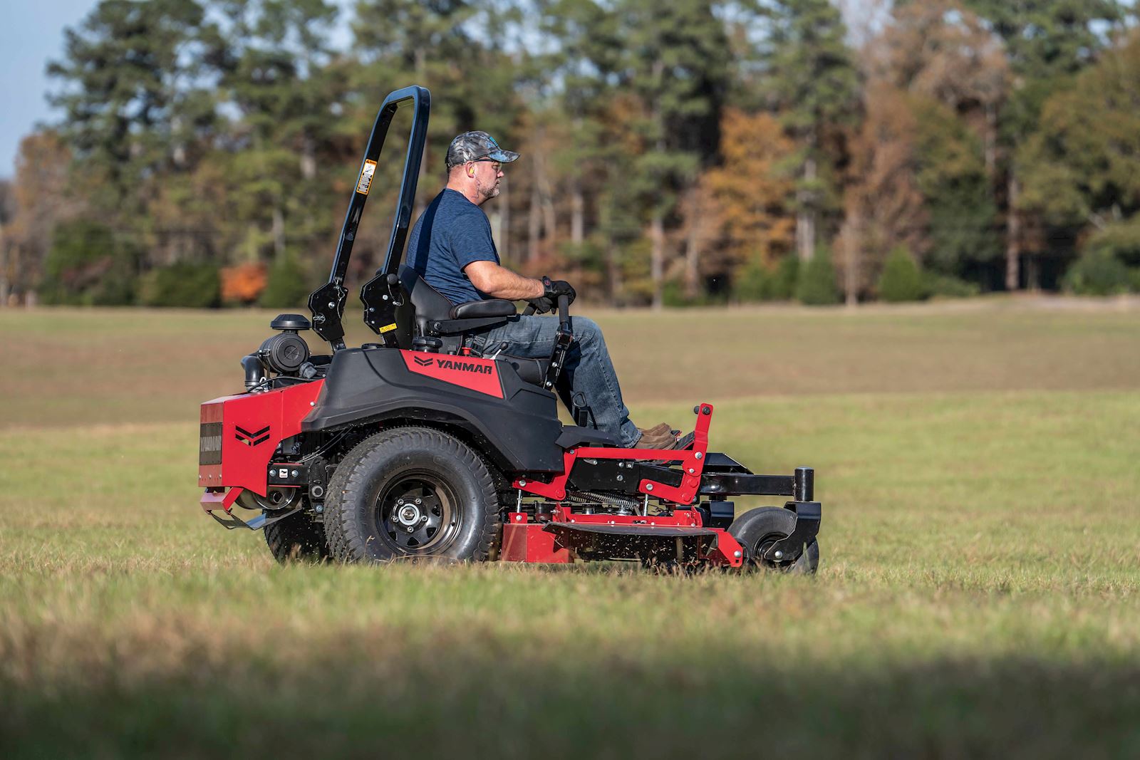 man mowing a large field