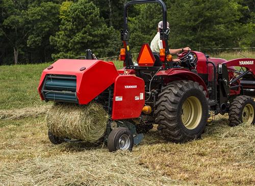 large red yanmar baler