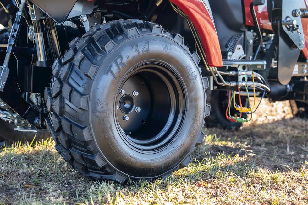 closeup view of SA223 KURO tires and black wheels