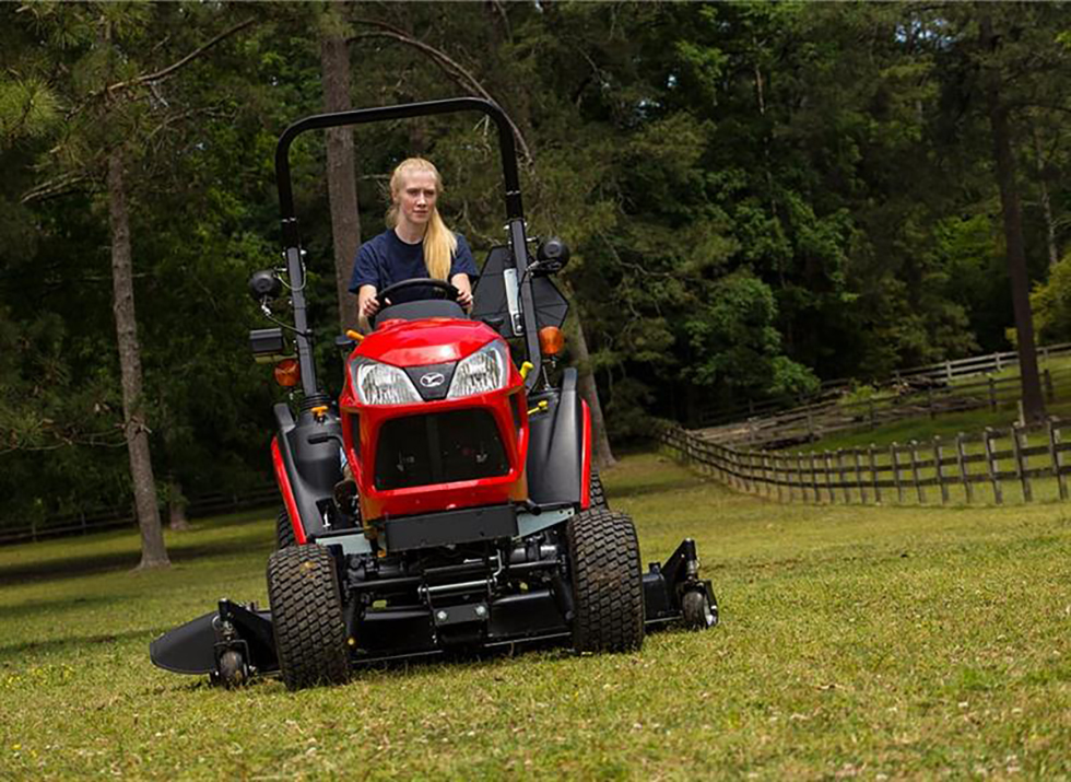 women on red sa 324 compact tractor